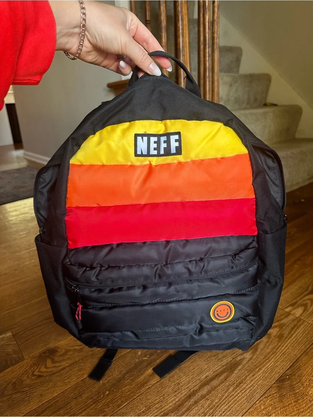 Neff Black Backpack with Yellow-Orange-Red Stripe Accent